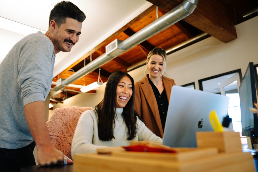 Power Digital team collaborating in their office